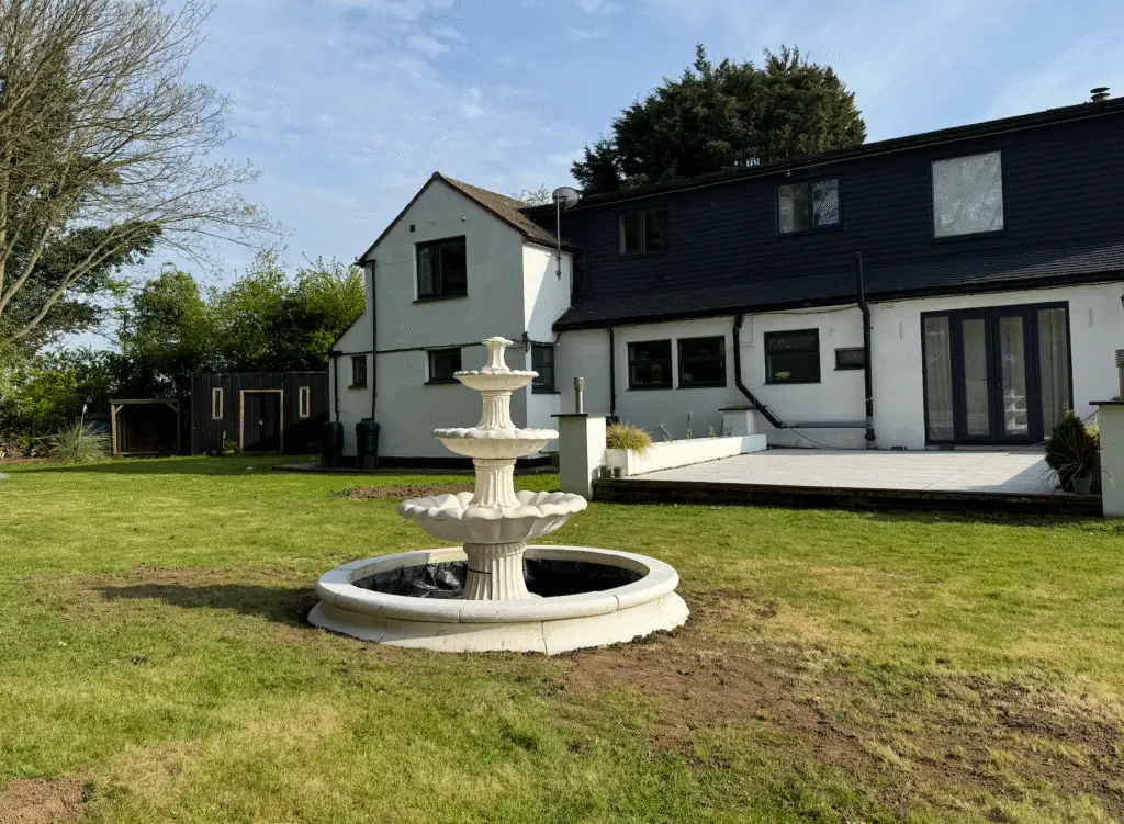 Beautiful stone water fountain with solid foundation built by Quality Builders Construction Ltd in Kent